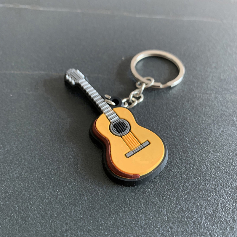 新着ギターキーホルダー男性女性パンクバイオリン楽器シリコーン - Musical Instrument Photo のレビューと価格